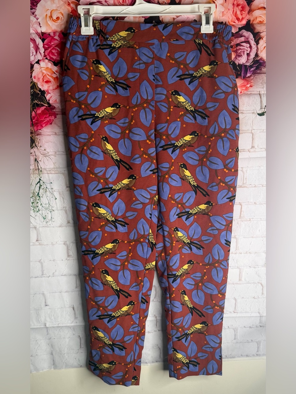 Anthropologie Rust trousers with Blue Leaf and Yellow Bird Print